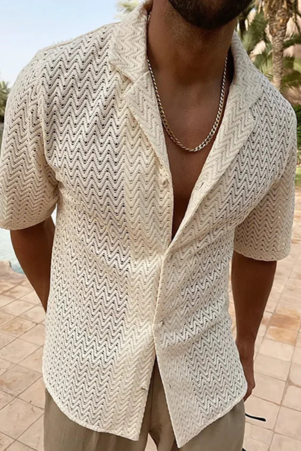 Casual men's short sleeve top featuring a unique chevron texture, relaxed fit, and open collar.