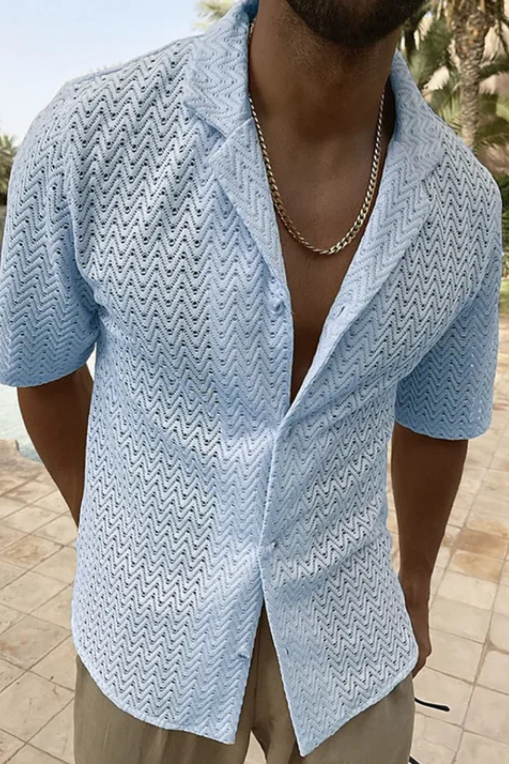 A casual men's top, relaxed fit, short sleeve, featuring a stylish chevron texture and open collar.