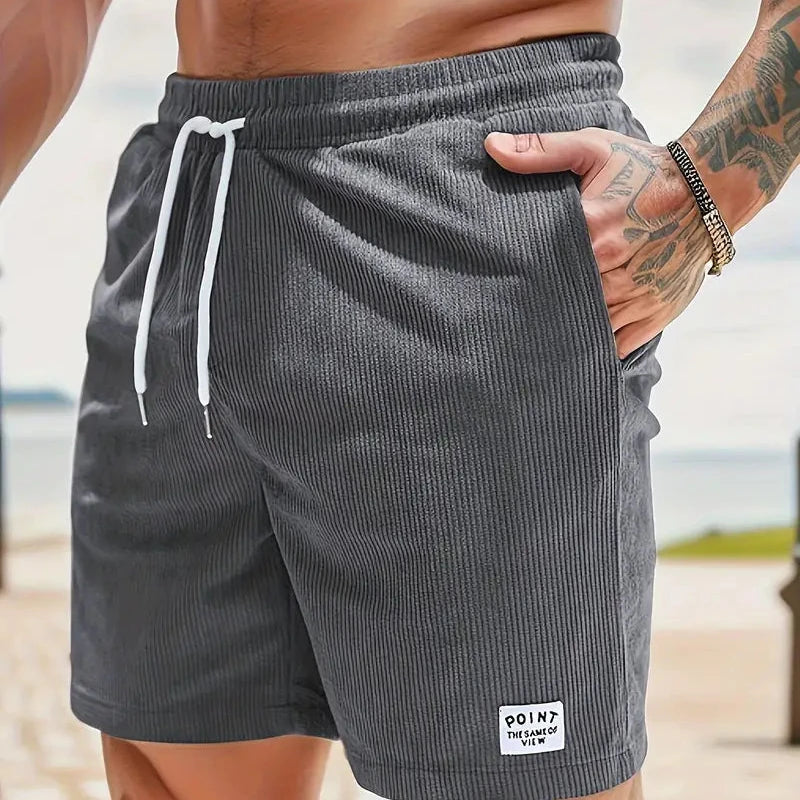 Stylish men's relaxed fit shorts with drawstring for comfortable spring fashion.