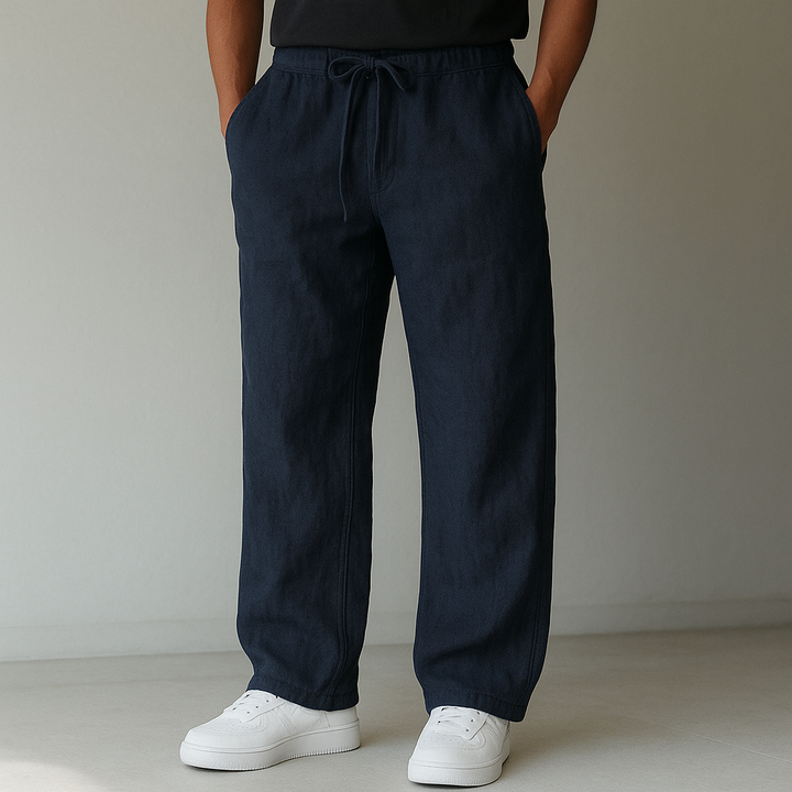 Men's relaxed fit linen trousers with a comfortable drawstring waist, perfect for casual summer wear.