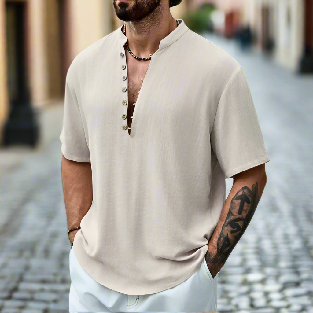 Men's relaxed fit short sleeve shirt with button neck, ideal for casual summer wear. Breathable & comfortable men's fashion.