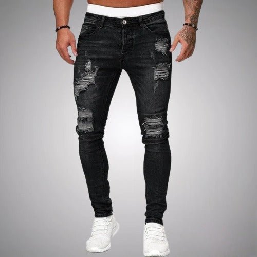 Men's ripped slim fit stretch pants in a stylish distressed blue for casual everyday wear and urban fashion.