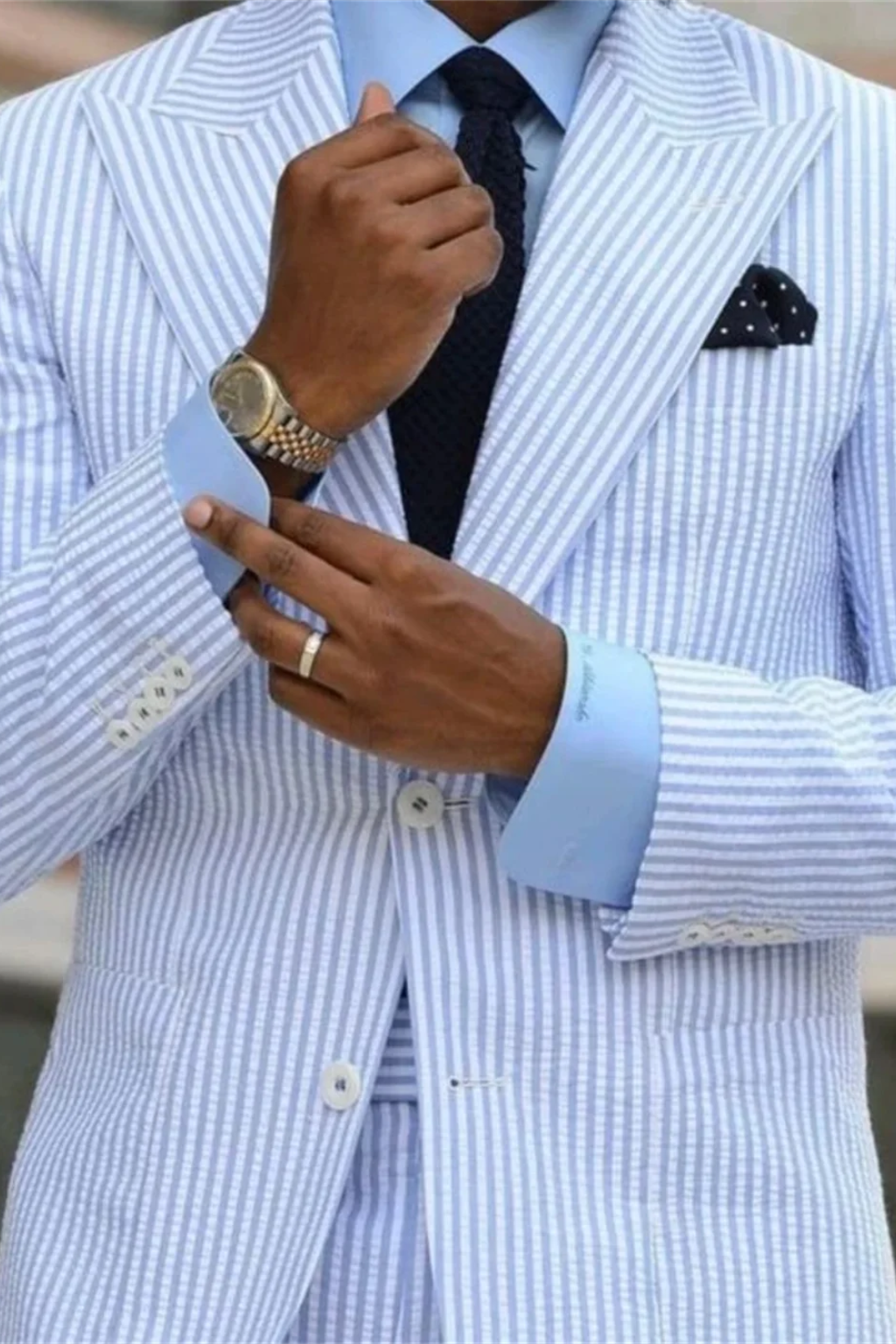 Elegant men's striped peaked lapel suit. Tailored sky blue two-piece formal wear, ideal for wedding guests & special occasions.