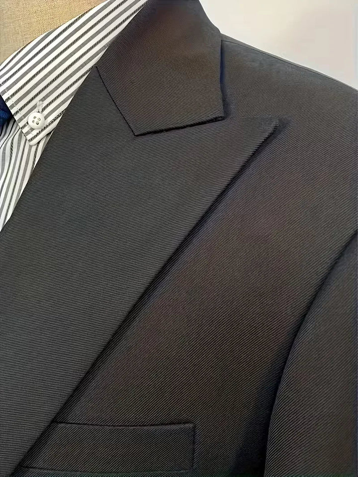 Sophisticated men's formal wear: a slim fit double-breasted 3-piece suit with a sharp waistcoat.