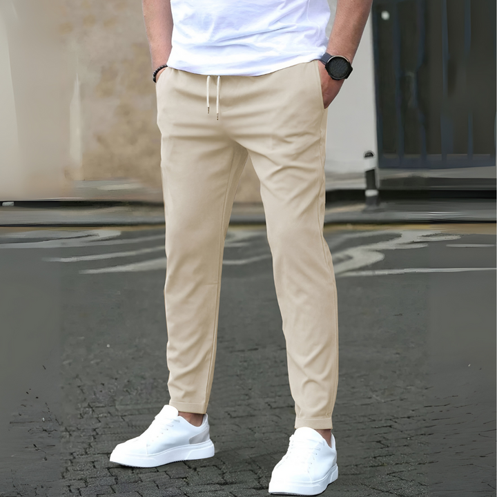 Comfortable men's everyday slim fit drawstring pants, ideal for travel, commuting, or athletic leisure.