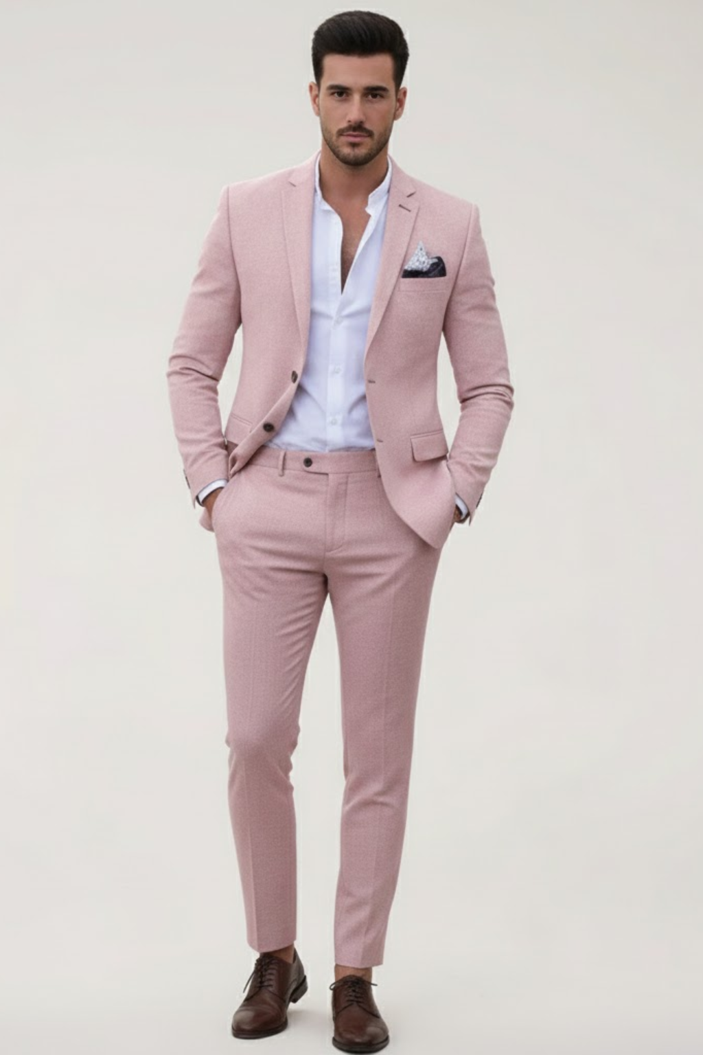 Pink men's slim fit suit set for spring. Modern tailored jacket & trousers, ideal for smart casual or events.