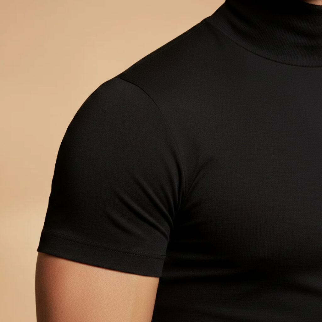 Man posing in a men's slim fit roll neck t-shirt, showcasing its fashionable and fitted apparel style.