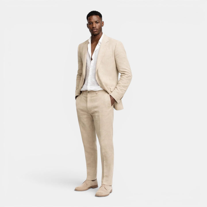 Versatile men's beige tailored suit set. Blazer & pants offer sophisticated style for formal or casual events.