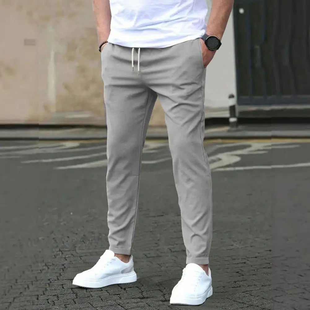 Men's sporty joggers with elastic waistband and side pockets. Ideal for gym, casual wear, or active lifestyles.