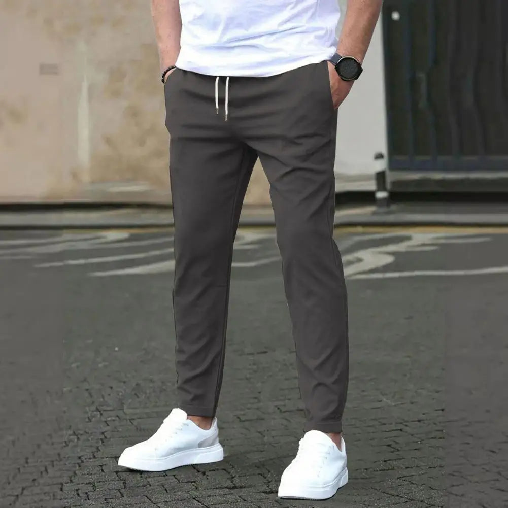 Athletic men's joggers, perfect for activewear, gym, or running. Features comfy elastic waist and spacious pockets.