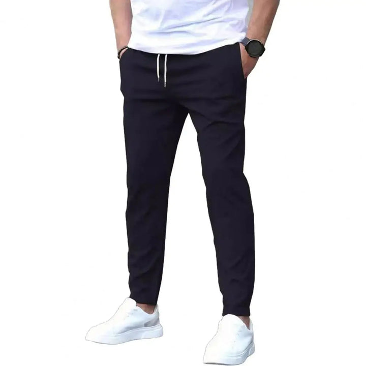 Versatile men's athletic pants. Sporty joggers with elastic waist and multi-functional pockets for gym or casual use.