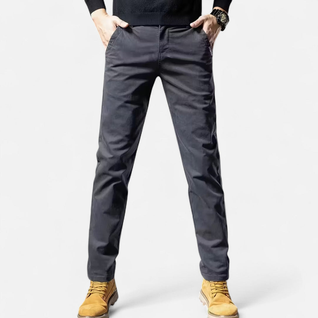 Stylish grey men's straight-leg tailored trousers. Ideal formal wear, business attire, and classic menswear.