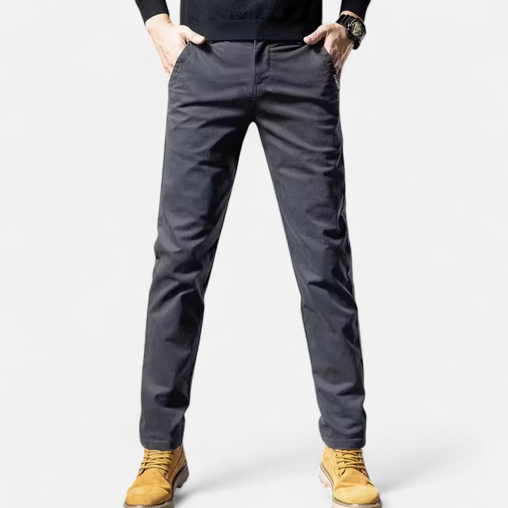 Stylish grey men's straight-leg tailored trousers. Ideal formal wear, business attire, and classic menswear.