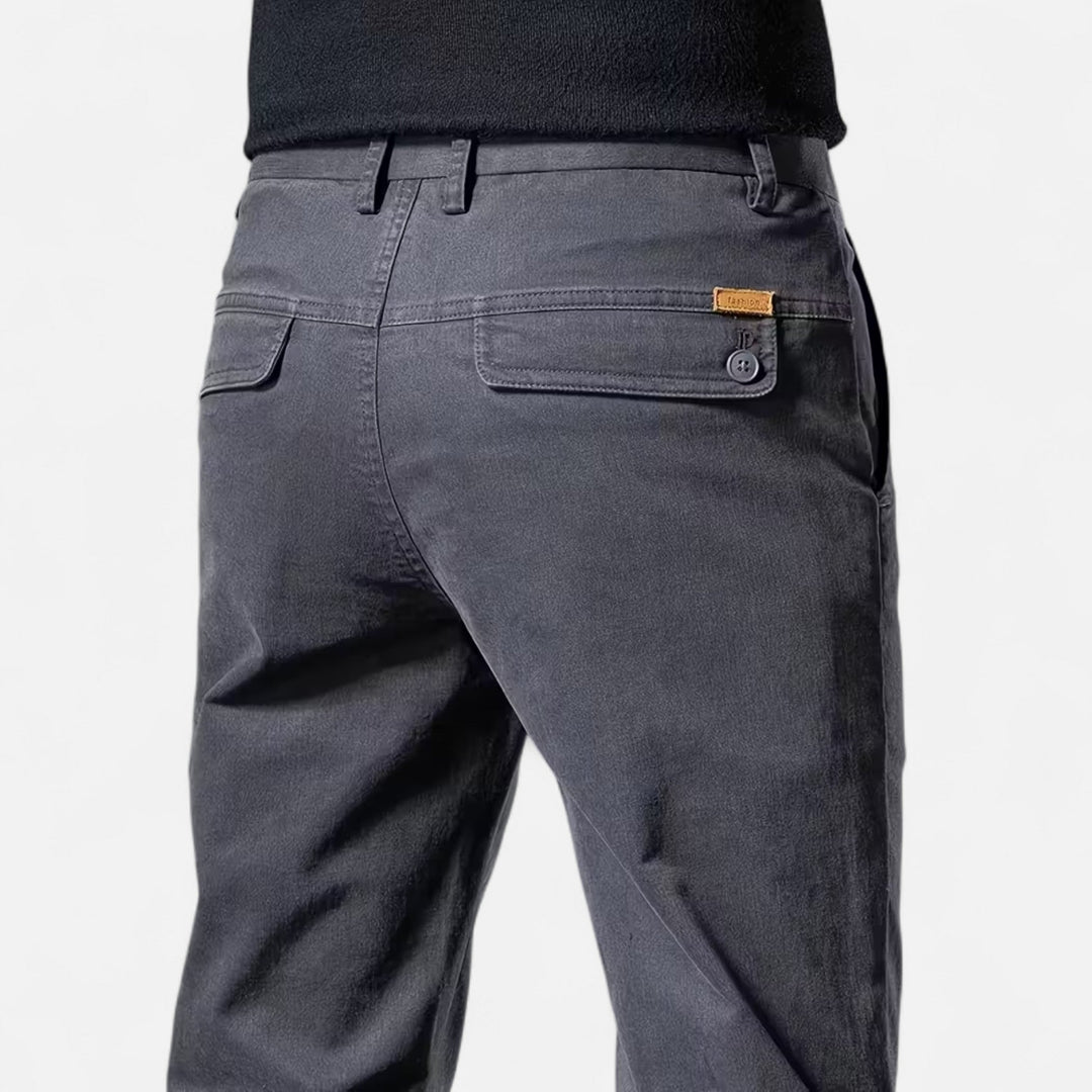 Assortment of straight-leg tailored trousers: black, grey, khaki, navy. Versatile classic menswear.