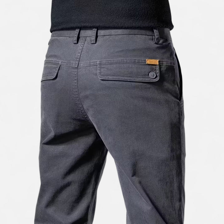 Assortment of straight-leg tailored trousers: black, grey, khaki, navy. Versatile classic menswear.