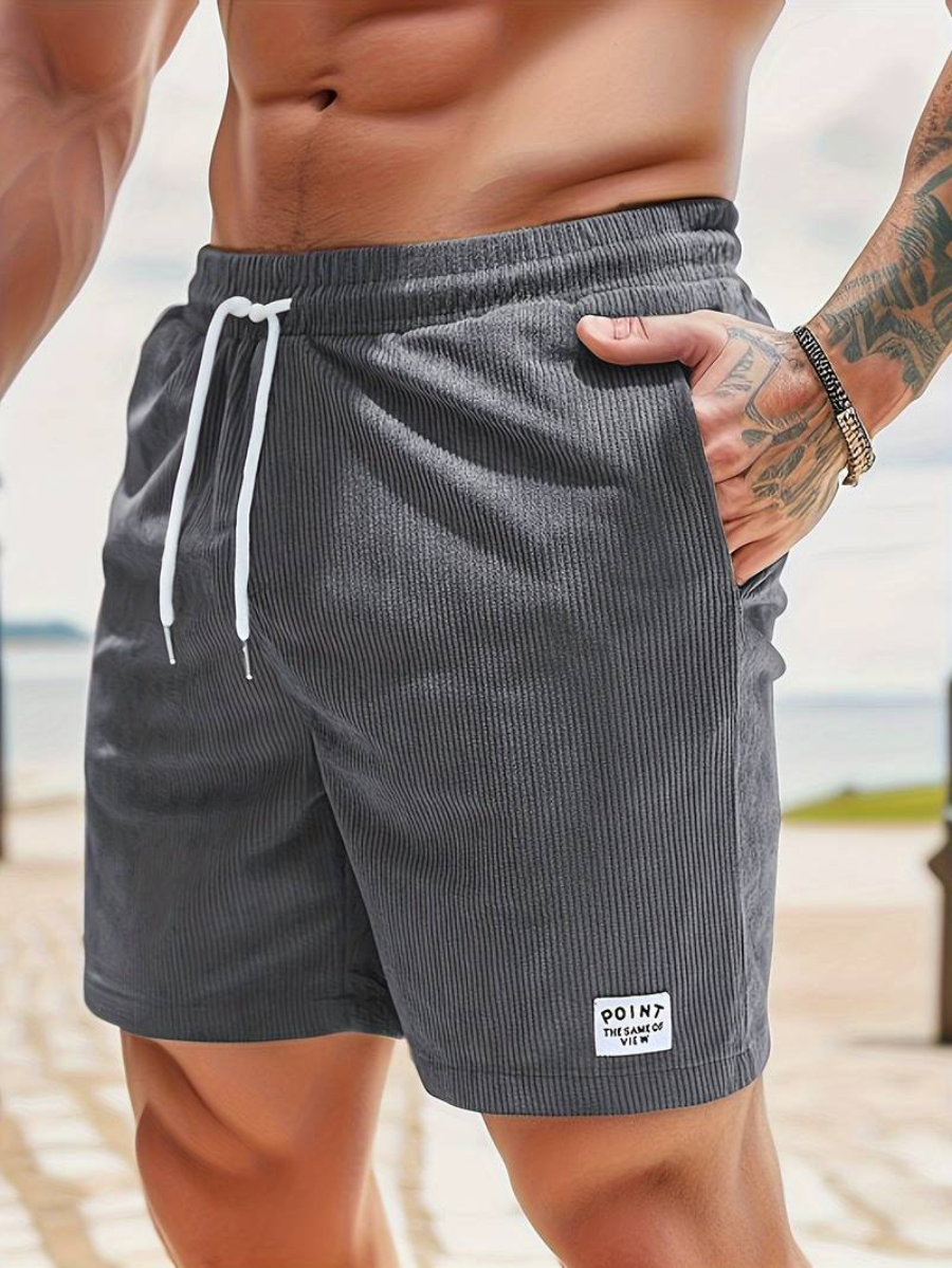 Men's stylish quick-dry swim shorts, perfect for beach, sport, and versatile summer casual wear. Active fit.