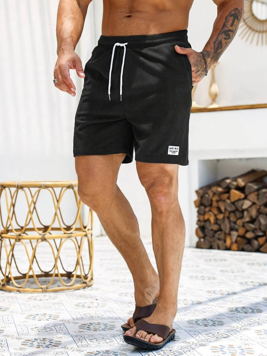 Stylish men's active shorts with quick-dry fabric, great for beachwear, swimming, and summer fashion.