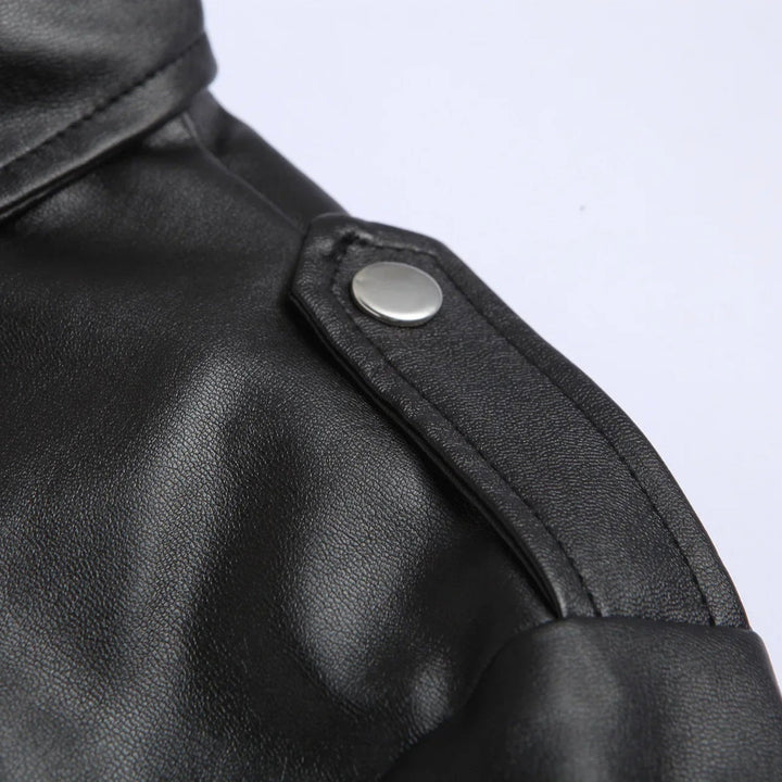 Close-up of a men's stylish bomber jacket showcasing the belted hem detail and functional zippered pockets. Modern design.