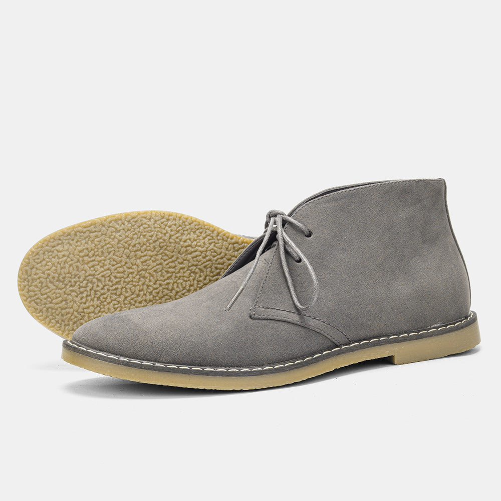 Close-up: Men's comfort boots. Premium brown leather, detailed stitching, offering ultimate comfort & style.