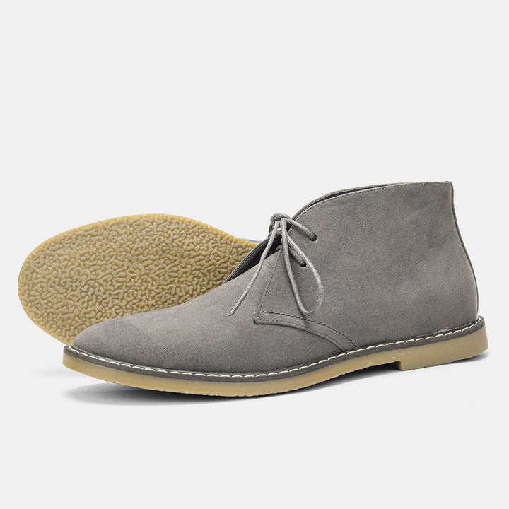 Close-up: Men's comfort boots. Premium brown leather, detailed stitching, offering ultimate comfort & style.