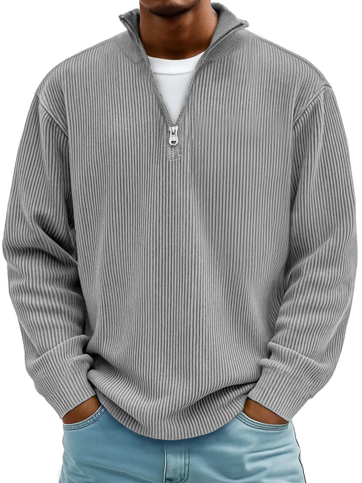 Stylish men's half-zip pullover sweater with a ribbed texture, perfect for comfortable everyday fashion.