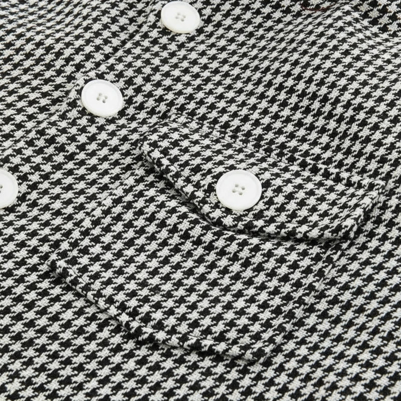 Stylish men's houndstooth jacket; a patterned button-down shacket, ideal outerwear for casual outfits.