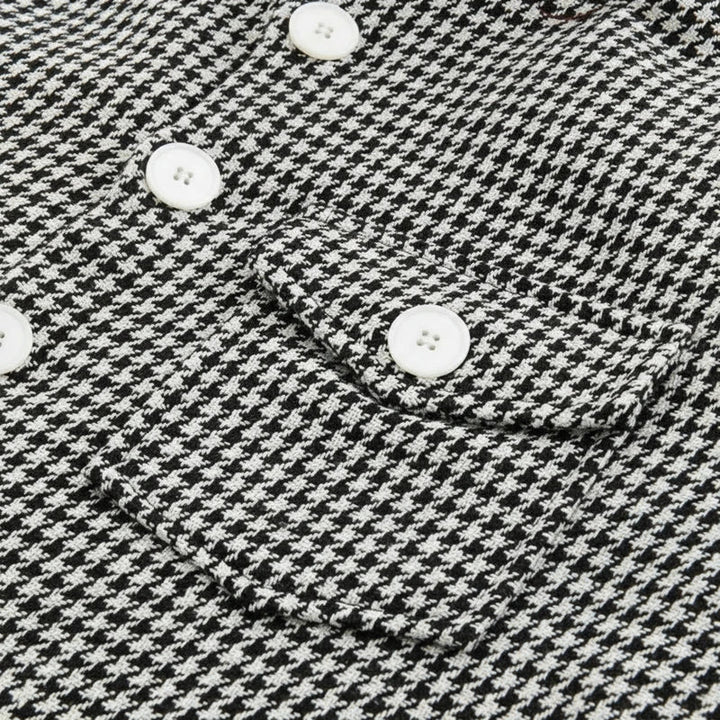 Stylish men's houndstooth jacket; a patterned button-down shacket, ideal outerwear for casual outfits.