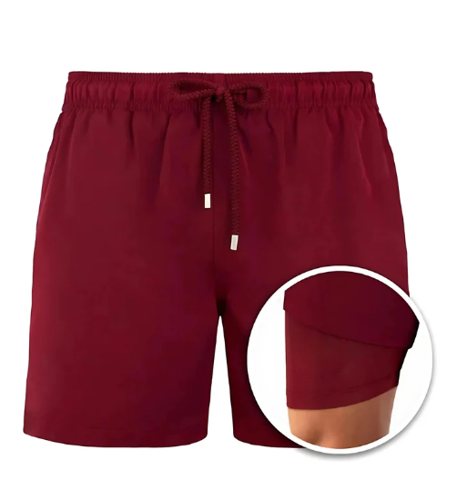 Men's stylish quick-dry swim shorts worn by a model, showcasing fit for vacation & resort wear.