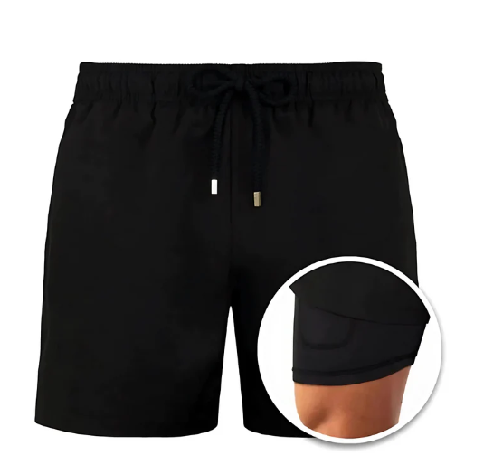 Man in men's stylish quick-dry swim shorts running on beach, highlighting activewear and comfort.