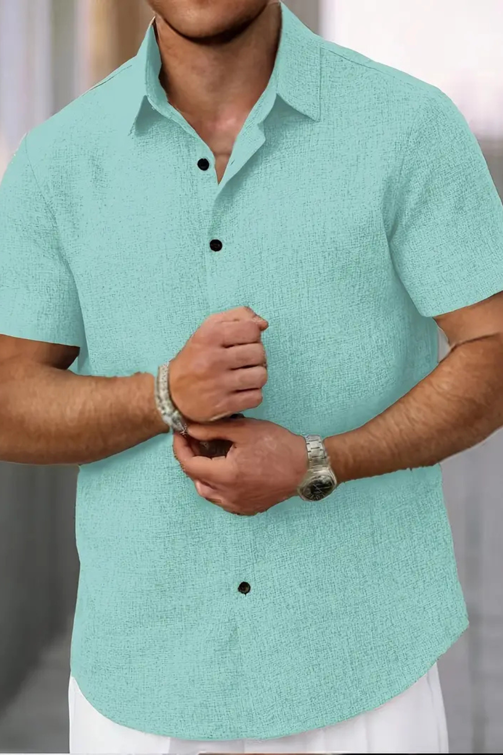 Lightweight men's collared short sleeve shirt, designed for comfort and effortless style during summer.