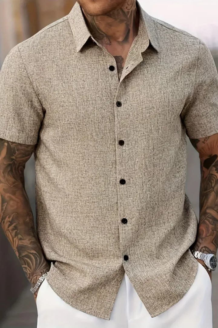 Modern men's button-down shirt with short sleeves, designed for stylish and comfortable summer wear.