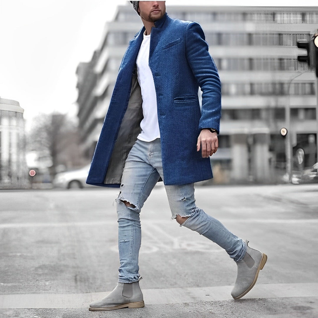 Stylish men's slim-fit mid-length trench coat with a modern stand collar. Great as a formal or casual winter jacket.
