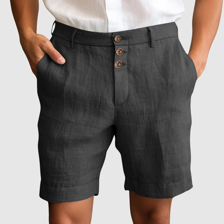 Stylish men's tailored casual shorts with a button fly, suitable for warm weather and versatile summer outfits.