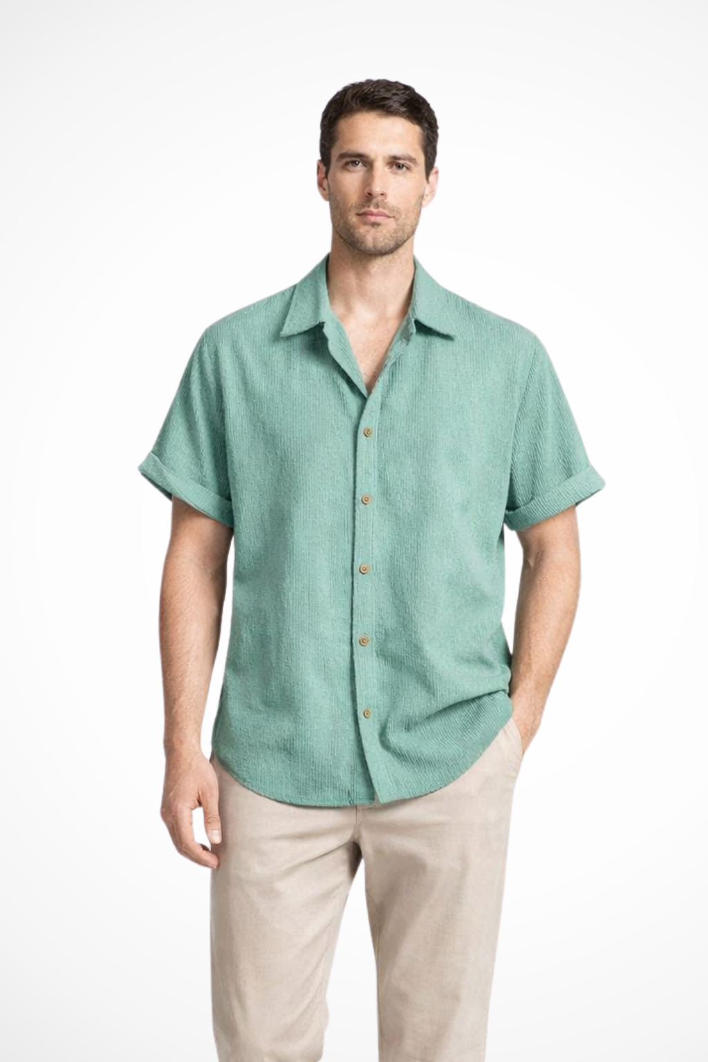 Close-up of textured fabric on a men's short sleeve button-down camp collar shirt, showing casual detail.