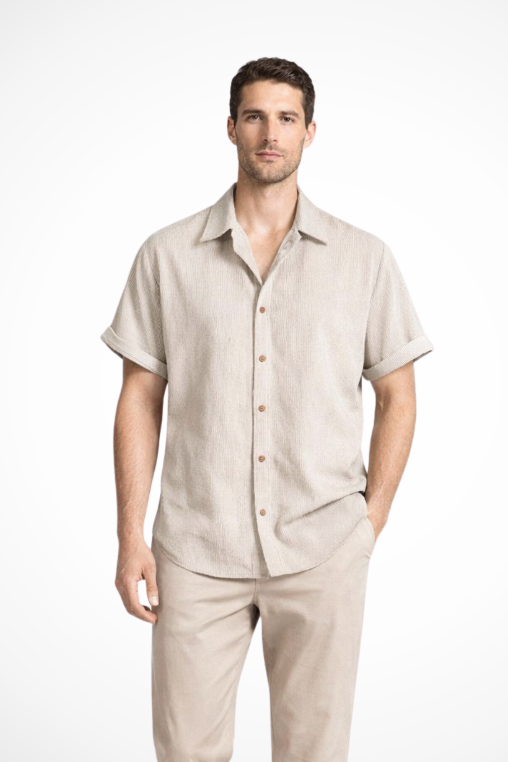 Man wearing a relaxed fit textured short sleeve camp collar shirt, showcasing stylish summer wear.