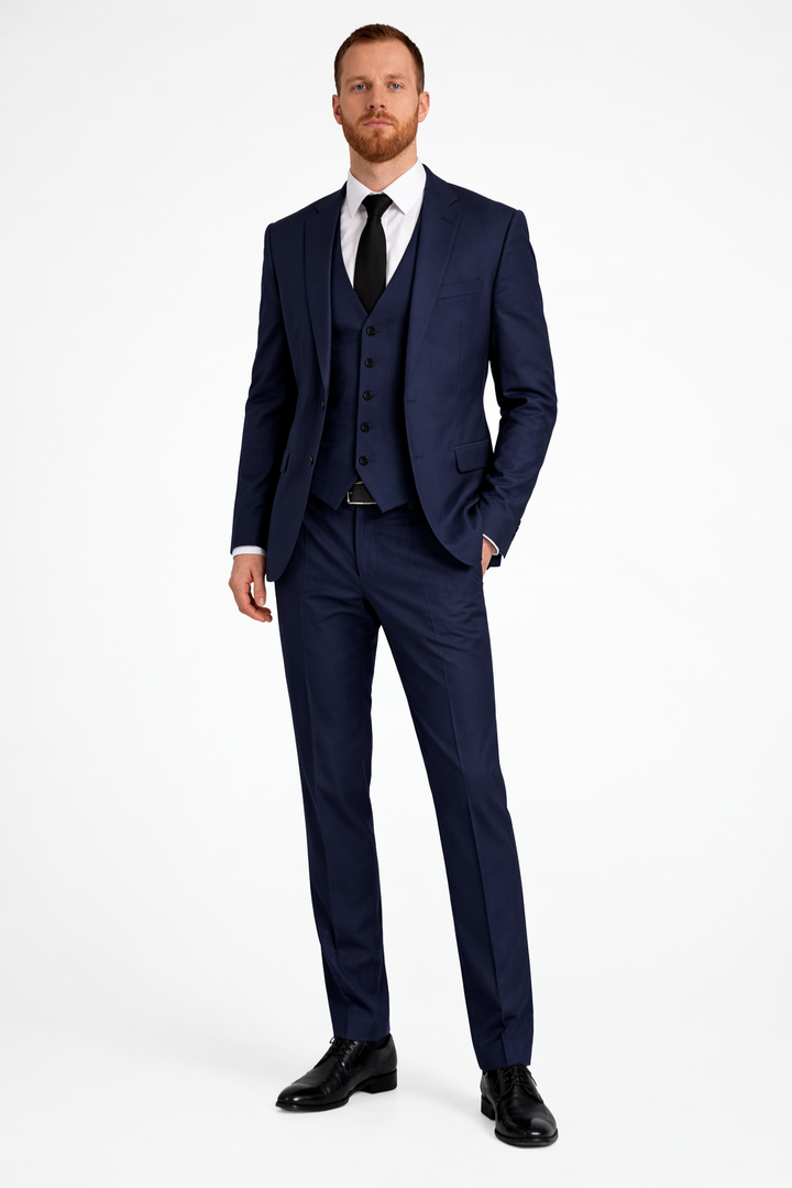 Finely crafted men's three-piece formal suit with blazer, waistcoat, and trousers, ideal for wedding guests.