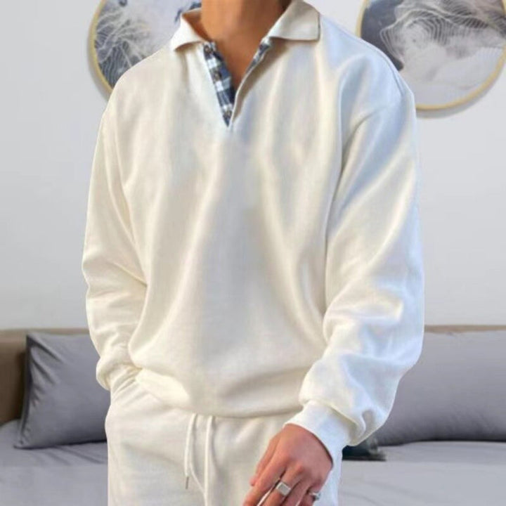 Stylish men's long sleeve polo sweater. Comfortable & breathable for versatile everyday wear. Modern relaxed fit.