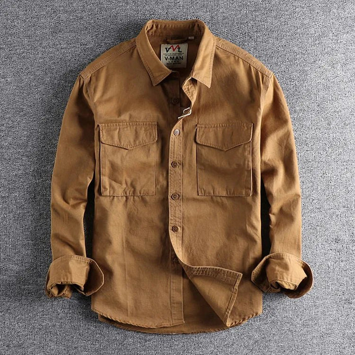 Stylish men's military green utility button-up shirt with long sleeves, ideal for casual and everyday fashion.