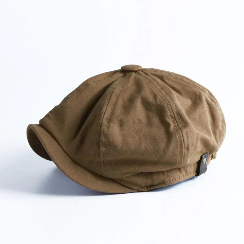 Stylish men's retro flat cap, evoking classic vintage fashion with a modern gentleman's touch.