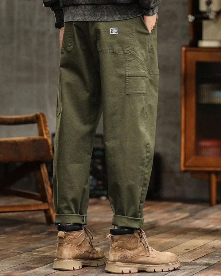 Khaki men's vintage utility cargo pants with multiple pockets, perfect for casual wear.