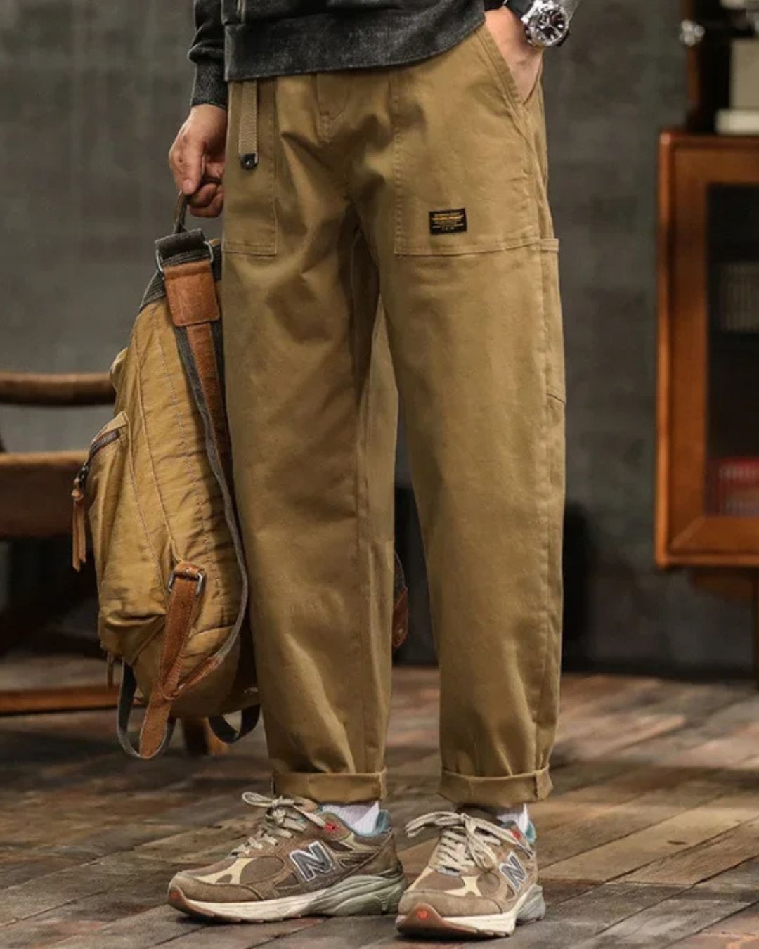 Black men's vintage style cargo trousers, relaxed fit, comfortable for casual looks.