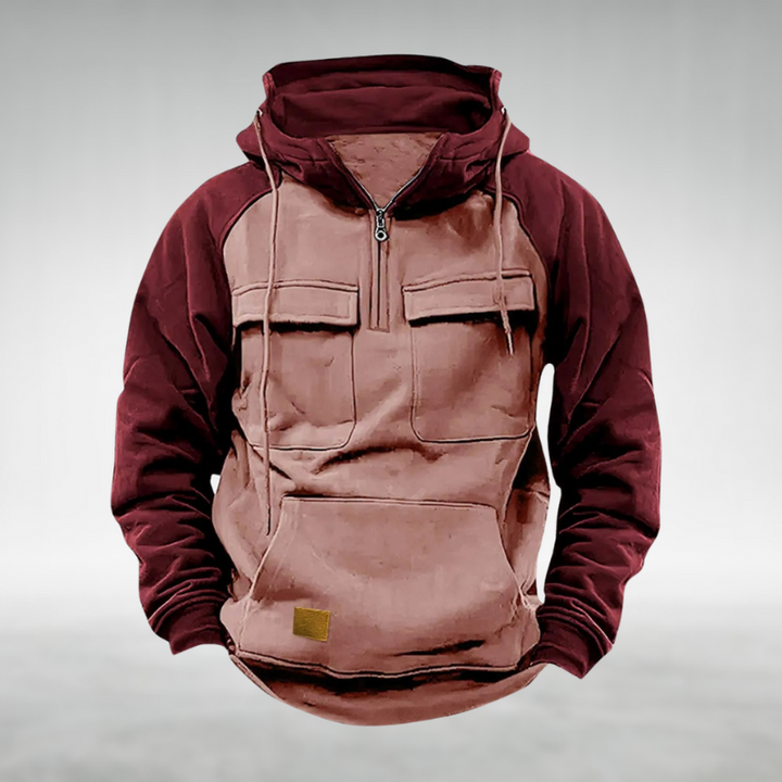 Man wearing a comfortable men's two-tone winter hoodie, ideal for outdoor adventure & casual style.