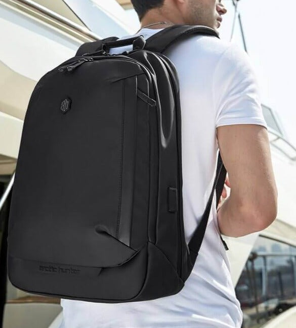 Stylish men's water-resistant travel backpack with anti-theft design & multiple functions for daily commute.