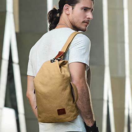 Men's water-resistant canvas crossbody bag, ideal for daily essentials & travel. Anti-theft pocket.