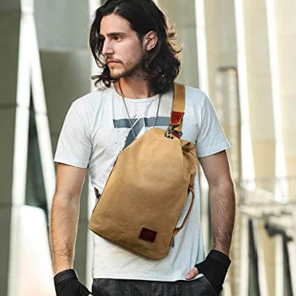 Men's anti-theft canvas crossbody bag, ideal for urban commuters & securing travel essentials.