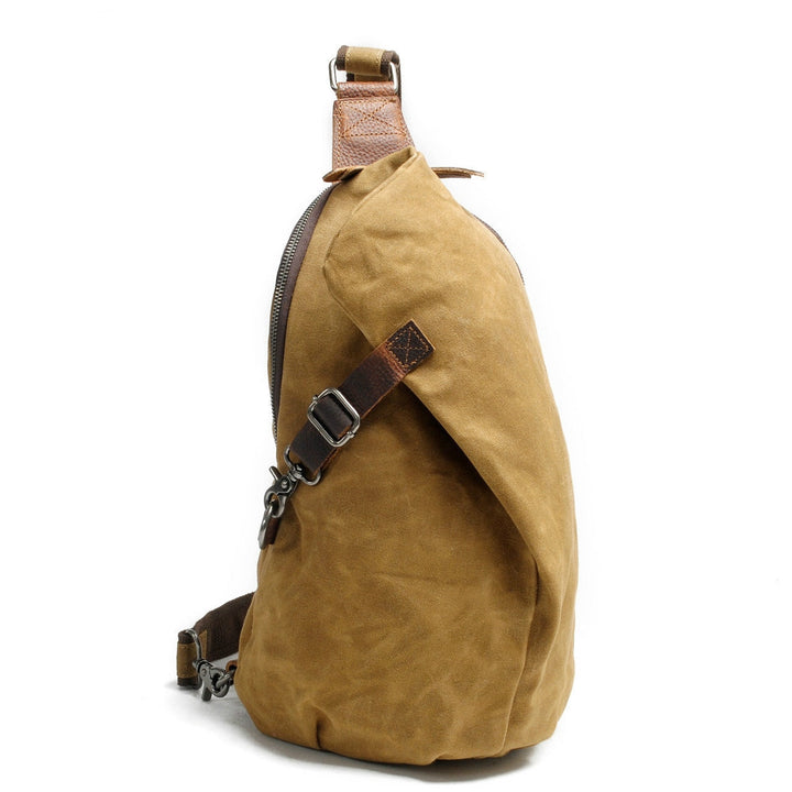 Men's water-resistant canvas crossbody bag with anti-theft pocket, shown open and closed.