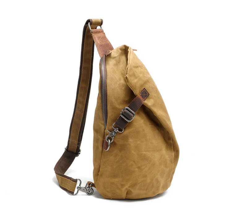 Adjustable strap on men's water-resistant sling bag for comfortable all-day wear. Back view.