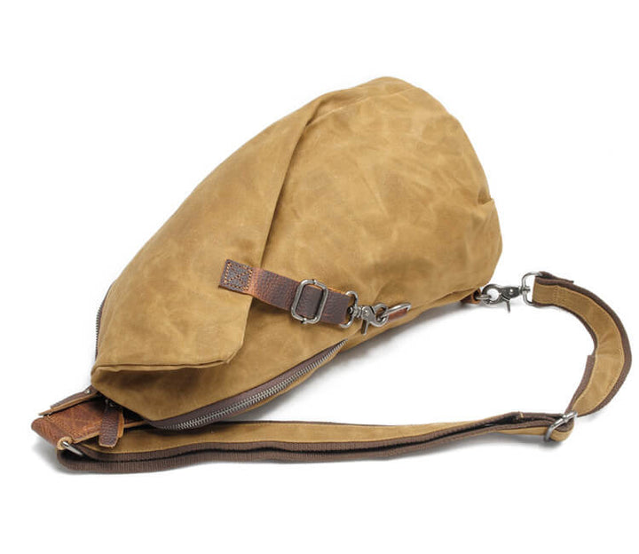 Sleek men's water-resistant canvas shoulder bag, versatile for daily essentials & commuting.