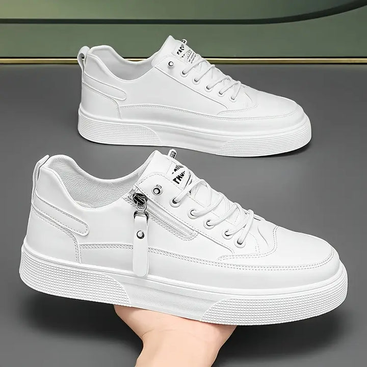 Stylish men's white leather sneakers, featuring a convenient side zip & cushioned sole for all-day comfort.