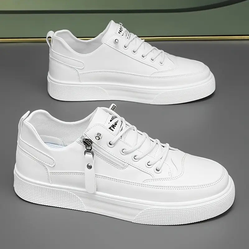 Close-up of a men's Hudson white leather trainer, showcasing the sleek design & functional side zip for quick wear.